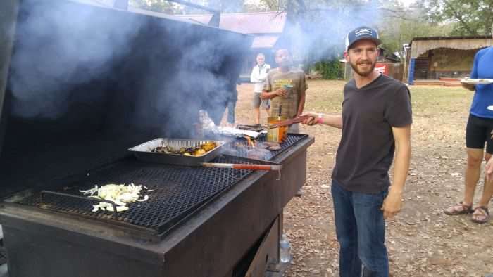 Colt cooks up the burgers.